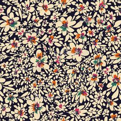 a black and white floral pattern with orange, red, green, and blue flowers