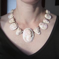 "Let me tell you something, you don't see a Victorian necklace like THIS every day! This exquisite necklace was made circa 1870 and features EIGHTEEN hand carved queen conch shell cameos of graduating size with alternating bacchante and cherub motifs, backed by 14k gold. Most likely a souvenir from the Grand Tour, this is as Victorian as it gets! Absolutely ethereal when worn and would make the most amazing, AMAZING necklace for a bride! Measures 18\" length. The largest cameo measures 2 x 1 5/8 Carved Seashells, Antique Cameo Jewelry, Antique Necklace Victorian, Intaglio Jewelry, Queen Conch Shell, The Grand Tour, Bling Ideas, Victorian Necklace, Cameo Jewelry