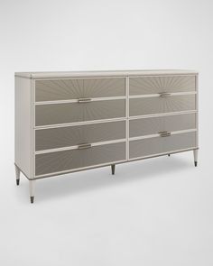 an image of a white dresser with drawers