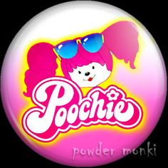 a button with the word poodle on it and two girls wearing sunglasses in front of them