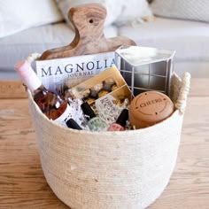 a basket filled with wine bottles and other items