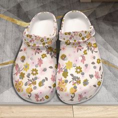 Step into summer with our Boho Floral Slip-On Clogs, the perfect blend of comfort and style for women.  Crafted with a lightweight design, these clogs feature a charming floral pattern that adds a touch of bohemian flair to any outfit.  Whether you're gardening, strolling on the beach, or simply running errands, these non-slip sandals offer reliable traction and support.  Slip them on effortlessly and enjoy the ease and versatility they bring to your summer wardrobe. The upper is made of EVA Fea Casual White Clogs For Vacation, White Slip-resistant Sandals For Spring, White Closed Toe Clogs For Vacation, Summer Flat Non-slip Clogs, White Clogs For Spring Vacation, Non-slip Flat Clogs For Summer, White Clogs For Vacation During Spring, Non-slip Round Toe Clogs For The Beach, Non-slip Open Toe Clogs For Beach