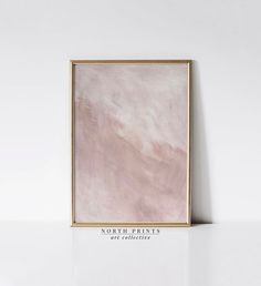 a pink painting hanging on the wall