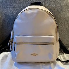 This Coach Backpack Is Absolutely Beautiful. It Has Only Been Used Less Than A Handful Of Times. The Interior And Exterior Are So Clean It Looks Brand New. The Straps Are Adjustable And So Comfortable. It Has The Main Compartment With A Zipper Inside. Then A Front Zipper Compartment As Well. The Interior Is A Dark Brown. The Exterior Is An Off White/Cream. It’s Beautiful White Standard Backpack For On-the-go, White Satchel Backpack For Errands, Designer White Travel Backpack, Designer White Backpack For Travel, White Standard Backpack For Errands, White Backpack For Errands, White Standard Backpack, White Backpack With Removable Pouch For On-the-go, White Luxury Backpack With Removable Pouch