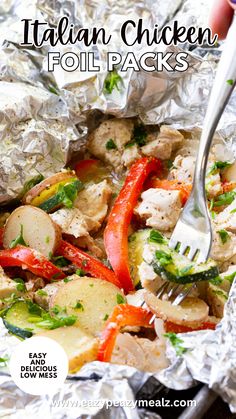 foil packet with chicken, potatoes and peppers in it that is being eaten by a fork