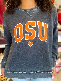 Oklahoma State University Campus Pullover Sweatshirt Relaxed Fit Tops For College In Fall, Relaxed Fit Tops For College Style In Fall, Relaxed Fit Tops For Fall In College Style, Cozy Cotton Leisure Tops, Collegiate Long Sleeve T-shirt With Relaxed Fit, Casual Soft-washed Sweatshirt For Loungewear, Oversized College Style Tops For Fall, Oversized Tops For Fall College Style, Collegiate Letter Print Tops For Fall