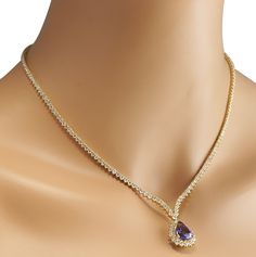 Stamped: 14K Yellow GoldTotal Necklace Weight: 21.7 GramsNecklace Length: 17 InchesNecklace Width: N/AGemstone Weight: Total Natural Tanzanite Weight is 6.56 Carat (Measures: 15.10x10.52 mm)Color: BlueDiamond Weight: Total Natural Diamond Weight is 10.11 CaratColor: F-G, Clarity: VS2-SI1Face Measures: 20.10x16.20 mmSku: [703024W] Gold Diamond Necklace, Natural Tanzanite, Natural Diamonds, Gold Diamond, Diamond Necklace, Yellow Gold, Yellow, Gold, Color