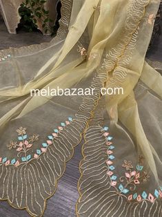 Beautiful gold dupatta with gota and embroidery motifs. Luxury Gold Dupatta With Motifs, Luxury Semi-stitched Dola Silk Dupatta, Gold Embroidered Fabric With Gota Work, Gold Embroidered Fabric With Gota Work In Traditional Drape, Traditional Drape Gold Embroidered Fabric With Gota Work, Eid Tissue Silk Dupatta With Dabka Work, Gold Silk Embroidered Fabric For Eid, Embroidered Gold Anarkali Unstitched Suit, Yellow Tissue Silk Dupatta With Dabka Work