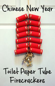 a bunch of red tubes hanging from the side of a door with text that reads, chinese new year toilet paper tube firecrackers