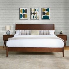 a bedroom with white brick walls and wooden furniture, including a bed that has two nightstands next to it