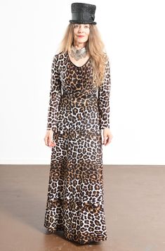 "70's Leopard Print Maxi Dress/ Leopard Print Empress Dress/ Vintage Leopard Print Dress/ Stevie Nicks Dress/ Size S Incredible 70's polyester knock out dress! In wonderful condition. Decorative buttons on the front upper portion of empress pipping. Zippers up the back. That's it! Amazing! So simple and easy to wear and yet so unbelievably chic! Leopard print maxi dress for all occasions! There is no tag. Model is 5'4\" and a size 4 for scale. Please see dress measurements below. Shoulder to sho Bohemian Fitted Long Sleeve Dress For Fall, Fitted Bohemian Long Sleeve Dress For Fall, Vintage Fitted Long Sleeve Dress For Fall, Fitted Vintage Long Sleeve Dress For Fall, Bohemian Leopard Print Dress, Fall Party Maxi Dress In Leopard Print, Leopard Print Maxi Dress For Fall Party, Retro Fall Maxi Dresses, Retro Long Sleeve Festival Dresses