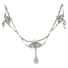 Genuine antique 1900's Edwardian platinum necklace featuring one large Pear European cut, 0,80 ct I-K color Vs2 clarity, Natural pearls and single-cut diamonds. This jewel is authentic in every part, the engraving and filigree make it unique. The necklace measures 14,9 inches long. CONDITION: Pre-owned - Excellent METAL: Platinum DESIGN ERA: Circa 1900 WEIGHT: 9,7 grams CHAIN MEASURES: 15,74 inches long. (40 cm) * every jewel is professionally tested by our internal gemological team of specialist I.G.I./HRD - the jewel comes with report card and warranty in a nice case Unique Diamond Necklace, Platinum Necklace, Natural Pearl Necklace, Report Card, Big Diamond, Pearls Necklace, Cartier Love, Sapphire Necklace, Pearl Diamond