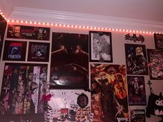 a wall covered in posters and lights