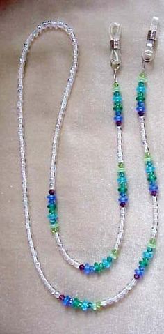 "This is an eyeglass chain that is elegant and has sea toned or jewtoned blues, greens and purple swarovski crystals with lovely matte czech glass beads in between with the main beads czech crystal ab round glass beads.it is approx 29\" long. it retails for $68 in gift shops and boutiques. it is strung on 49 strand nylon coated flexible and non kinking wire.if you would prefer to wear this as an eyeglass necklace, i can change the ends to a large loop for you to hang your glasses thru like a nec Eyeglass Jewelry, Eyeglass Chain Holders, Eyeglasses Holder Necklace, Eyewear Chain, Eyeglass Necklace, Gelang Manik, Beaded Lanyards, Eyeglass Chain, Glasses Chain