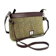 Our Harris Tweed Large Shoulder Bag is a brilliant size with a durable style, that can be used every day. The shoulder bag has one main compartment, secured with a zip. Inside this Harris Tweed bag there are open pockets for phones and essentials as well as a small zip compartment. This bag has a short shoulder strap as well as a longer detachable strap that you can wear across your body. Large Shoulder Bag Dimensions: 20cm x 30cm x 9cm The vegan leather trim colour will differ depending on the Classic Rectangular Tweed Shoulder Bag, Classic Tweed Rectangular Bag, Classic Rectangular Tweed Bag, Classic Tweed Bags For Everyday Use, Classic Tweed Bag For Everyday Use, Classic Tweed Bags For Everyday, Brown Tweed Travel Bag, Beige Tweed Rectangular Bag, Beige Rectangular Tweed Bag