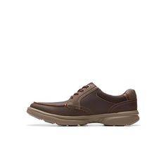 This lace-up style goes anywhere, thanks to a full grain leather upper with an apron toe and a durable outsole made from lightweight EVA. As an ultimate comfort style, Clarks Bradley vibe, benefits from full-length cushioning and a moisture-wicking ortholite foot bed..Heel height- 1.38'.Shoe width- medium, wide.Lace closure.Manmade outsole.Slip on.Light weight and comfortable.Arch support.Removable foot bed.Leather Upper, Textile Lining.Hand Wash.Imported Brown Moc Toe Lace-up Shoes With Leather Footbed, Business Walking Shoes With Rubber Sole, Leather Lace-up Oxfords With Vibram Sole, Rugged Leather Walking Shoes With Removable Insole, Classic Leather Walking Shoes With Plain Toe, Leather Walking Shoes With Removable Insole, Classic Plain Toe Leather Walking Shoes, Classic Leather Moc Toe Walking Shoes, Classic Walking Shoes With Ortholite Insole