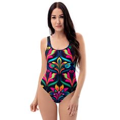 This one-piece swimsuit for all figures will bring out your best features. Enjoy the smooth fabric and the flattering design, and show it off by the sea or pool! * 82% Polyester, 18% Spandex * Fabric weight: 6.78 oz/yd² (230 g/m weight may vary by 5% * Chlorine-resistant fabric * Cheeky fit with a scoop neckline and a low scoop back * Zig-zag stitching * Double-layer front  * Four-way stretch material stretches and recovers on the cross and lengthwise grains Designed in the USA by JBLgrafix Fitted Multicolor One-piece For Sunbathing, Multicolor One-piece Swim Dress For Beach Season, Multicolor Printed One-piece For Poolside, Multicolor Tropical One Pieces For Beach Season, Tropical Stretch One-piece Tankini, Fitted Multicolor Swim Dress For Pool, Stretch Multicolor Bodysuit For Beach Party, Multicolor Stretch Bodysuit For Beach Party, Fitted Multicolor Swim Dress For Beach Season