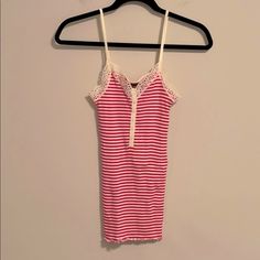 So Cute Thrills By Nordstrom 100% Cotton Strawberry Pink And Creamy White Striped Camisole. Darling Detail In The Front And Pretty Lace Around The Neckline And Arm Area. Wear This Under A Gorgeous Cashmere Sweater, Blazer Or Dress It Down With A Jean Jacket. Or Wear As A Tank To Bed. Very Stretchy And Comfortable. Size Medium. This Is Small Looking But Has Tons Of Stretch Fitted Striped Tank Top With Spaghetti Straps, Cute Fitted Tank Camisole, Cute Stretch Cami Tank Top, Cute Lace Trim Cami Camisole, Cute Lace Trim Camisole, Cute Camisole With Lace Trim, Nordstrom Sleeveless Summer Tops, Nordstrom Sleeveless Tops For Spring, Nordstrom Sleeveless Tops For Summer