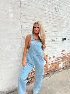 Denim colored overalls. Features 2 side pockets, one front pocket, a rigid denim material and adjustable straps. Finished with a open back, back pockets and cargo pocket bottoms. Fits relaxed. Nina is 5'2" and is wearing a small 100% Cotton Hand wash cold, hang or line dry RETURN POLICY: 30 DAY RETURN FOR STORE CREDIT ONLY. ORIGINAL TAGS MUST BE ATTACHED TO UNWANTED ITEM FOR THE RETURN TO BE ACCEPTED Casual Cargo Jeans Overalls, Utility Jumpsuits And Rompers With Pockets In Medium Wash, Casual Denim Cargo Jumpsuit, Casual Denim Cargo Style Jumpsuit, Utility Denim Blue Jumpsuit With Side Pockets, Denim Cargo Pocket Jumpsuit Overalls, Summer Denim Jumpsuit With Cargo Pockets, Summer Denim Cargo Jumpsuit, Trendy Overalls Shortalls With Pockets