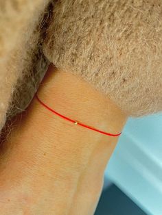 This red string bracelet is made from silk cord and solid 14K gold, 2 mm bead. Wish bracelet is a beautiful way to give someone you care for a wish. All they have to do is make a wish and then tie the cord around their wrist. When the cord finally wears down and breaks the wish is released and will come true - so they say! Details: * 14K solid gold in front, bead in the middle and 2 beads on the tassel is made from gold vermeil. Waterproof Silk String * Adjustable clasp stainless steel metal. 🎁 Red Cord Bracelet, Cheap Customized Red Friendship Bracelets, Red String Of Fate, Tom Y Jerry, Silk Bracelet, Good Luck Bracelet, Red Bracelet, Bracelets Handmade Diy, Red String Bracelet