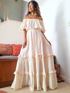 Bohemian off shoulder wedding dress . Double Ruffle and unfinished hem. Elastic neckline and waist. Can be worn as cover or off shoulders and one side shoulders. 100% cotton with lined. 2 pockets in the front. Color Off White. Measurements: The model is 5'5 Bust 30 up to 42 inches. Hip Free. Length 56 inches. CARE: Machine wash cold. White Off Shoulder Wedding Dress With Ruffles, Bohemian Off Shoulder Maxi Dress For Beach, Bohemian Off-shoulder Maxi Dress For Beach, White Bohemian Off-shoulder Maxi Dress, Bohemian Beige Strapless Dress, Off-shoulder Ruffled Maxi Dress For Wedding, Off-shoulder Cream Wedding Dress, Bohemian Strapless Dresses With Ruffles, Beige Off-shoulder Bohemian Dress