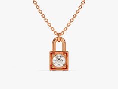 Unlock a world of timeless elegance with our Lock Necklace in luxurious 14k Solid Gold, adorned with a captivating round diamond. Meticulously crafted, this enchanting piece features a delicate gold chain and a stylish padlock pendant, adding a touch of modern sophistication and brilliance. FEATURES • Made to Order • Height: 7.70 mm • Width: 4.40 mm • Gold Kt: 14k Solid Gold, 18k Solid Gold • Available Gemstones: Diamond, Moissanite • Gemstone Cut: Round • Diamond Color - Clarity: G Color - SI1 Classic Gold Jewelry With Lock Detail, Classic Gold Lock Jewelry, Formal Gold Jewelry With Lock, Luxury Lock Jewelry For Gift, Gold Luxury Solitaire Necklace For Everyday, Luxury Gift Solitaire Necklace With Single Diamond, Luxury Diamond Solitaire Necklace With Adjustable Chain, Luxury Solitaire Necklace With Single Diamond As Gift, Luxury Solitaire Diamond Necklace With Adjustable Chain