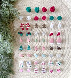 christmas decorations are arranged on a knitted mat