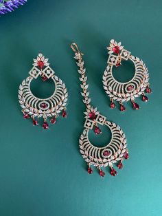 American diamond chandbali style earring with Tikka. Push back , light weight earring is about 3 inch long and Tikka 21/2. Festive Chandbalis With Stone Work And Cubic Zirconia, Festive Chandbalis With Cubic Zirconia Stone Work, Wedding Chandbali Chandelier Earrings With American Diamond, Festive American Diamond Chandbalis With Stone Work, Cubic Zirconia Chandbali Bridal Earrings With Stone Work, Festive Cubic Zirconia Chandbalis With Stone Work, Traditional Festive Chandelier Earrings With Cubic Zirconia, Traditional Cubic Zirconia Chandelier Earrings For Festive Season, Chandbali Danglers With Intricate Design In Cubic Zirconia