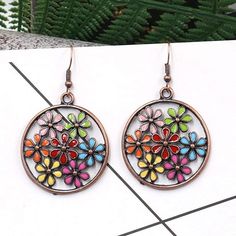 A timeless design with a boho touch, these 2” Bronze-tone Multicolor Earrings are perfect for any wardrobe. Crafted with high-quality metal and an eye-catching multicolor pattern, these earrings will be the perfect addition to any outfit. The Bohemian Retro Drop Dangle Hook ensures a secure and comfortable fit. Big round dangle with colorful flower décor, very statement and pretty, a nice accessory for stylish look. Suitable for all occasions, such as an anniversary, engagement, party, meeting, Summer Dangle Flower Earrings, Summer Metal Dangle Flower Earrings, Multicolor Round Earrings For Summer, Nickel Free Multicolor Metal Hoop Earrings, Nickel-free Multicolor Metal Hoop Earrings, Multicolor Bohemian Hoop Earrings For Spring, Bohemian Dangle Hoop Earrings For Spring, Bohemian Alloy Earrings For Festivals, Multicolor Metal Hoop Earrings