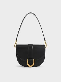 Our coveted Gabine saddle bag is back in an array of brand new colourways. The signature black piece, featuring the much-loved classic curved-bottom silhouette and gold-tone buckle accent, is once again designed to be worn and displayed. Roomy enough to hold your daily essentials, this medium-sized gem has a short shoulder strap, plus a longer one that can be detached and adjusted for maximum carrying versatility. It will also put the perfect finishing touch on any outfit from casual off-duty fi Lily May Mac, Gabine Saddle Bag, Yoyo Cao, Charles And Keith, Aimee Song, Size Chart For Kids, Charles Keith, Chic Accessories, Saddle Bag