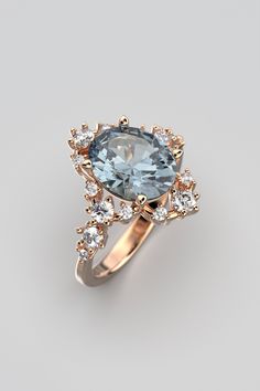 Enhance your romantic narrative with our exquisite Engagement Ring featuring a Natural Aquamarine and Diamonds, meticulously crafted by Oltremare Gioielli in Italy. This enduring piece highlights a dazzling oval-shaped aquamarine, approximately 2.3 carats, boasting a captivating light blue hue. The aquamarine, measuring 10 x 8 x 5.2mm, ensures a captivating presence on the finger. At the heart of the design, the aquamarine takes center stage, embraced by a halo of diamonds totaling around 0.48 carats. These diamonds not only accentuate the brilliance of the aquamarine but also add an extra layer of sophistication and sparkle to the ring. Each ring is tailored to your preferences, allowing for customization of this symbol of your love. Opt for 14k or 18k solid gold in white, rose, or yellow Elegant Rose Gold Diamond Ring With Accent Stones, Luxury Rose Gold Topaz Ring For Wedding, Exquisite Brilliant Cut Topaz Ring, Luxury Brilliant Cut Topaz Ring For Wedding, Elegant Rose Gold Topaz Ring With Accent Stones, Exquisite Brilliant Cut Topaz Ring For Wedding, Luxury Wedding Topaz Ring With Prong Setting, Luxury Prong Setting Topaz Wedding Ring, Exquisite Brilliant Cut Topaz Wedding Ring