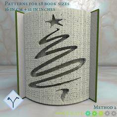 an open book with a christmas tree drawn on it