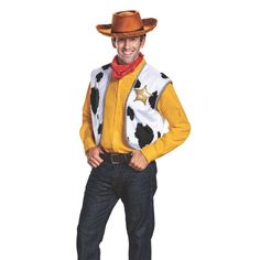 a man in a cowboy hat and sweater posing for the camera with his hands on his hips