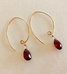 "Stunning rich red Luxe AAA Mozambique garnet earrings in 14k gold fill or Sterling silver. Beautiful 10/11x 7mm faceted rich burgundy red garnet pear briolettes wire wrapped on handmade 14k gold fill ear wires. These garnets are a gorgeous red color, clear and translucent. Total drop length is 1 3/4\"." Red Faceted Garnet Earrings, Red Garnet Wire Wrapped Earrings, Red Garnet Teardrop Earrings, Red Teardrop Garnet Earrings, Teardrop Garnet Red Jewelry, Red Garnet Earrings, Arizona Turquoise, Rich Burgundy, Garnet Earrings