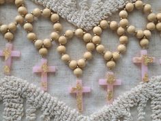 Price is for 12 mini rosaries. Each comes in their own favor bag Handmade mini rosaries available in pink, blue, and white. Cross is made out of epoxy resin Choose between gold or silver flakes Dark and Light wood beads available Perfect for your baptism or communion party favors Custom orders available, just message me and I will gladly work with you Handmade Pink Rosary For First Communion, Handmade Pink Rosary For Baptism, Handmade Pink Rosary With Round Beads, Handmade Pink Spiritual Rosary, Handmade Rosary With Round Beads For Baptism, Handmade Pink Rosary With Cross Shape, Handmade Pink Rosary In Cross Shape, Handmade Pink Rosary With Cross, Handmade Pink Cross Rosary