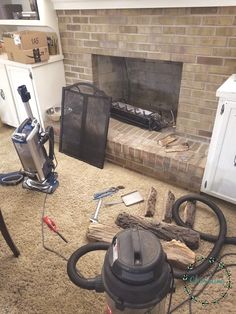 a living room filled with furniture and a fire place next to a brick fireplace covered in clutter