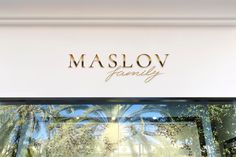 there is a sign that says maslov family on the side of a store front