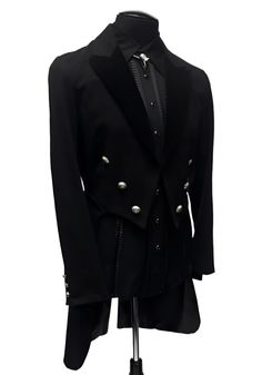 A formal Victorian coat with tails. Great for special occasions, formal events, or when you want to stand out from the crowd. Heavy brushed black denim fabric with luxurious black velvet lapels. Fully lined in rich black satin. Six ornate metal buttons decorate the front and two at the waist in back. Three smaller metal buttons are at each cuff. Comes in sizes Small-3X. I love this one!! Measurements: Small - Chest 40" Waist 30-34" Medium - 42-44" Waist 32-38" Large - Chest 46" Waist 36-40" XL - Black Blazer For Black-tie Events In Winter, Tailored Black Tuxedo For Winter, Black Winter Tuxedo, Black Tuxedo For Semi-formal Occasion, Black Winter Tuxedo For Formal Occasions, Black Tailored Tuxedo With Buttons, Black Suits For Black-tie Events In Fall, Black Tuxedo For Fall, Gothic Black Outerwear For Formal Occasions