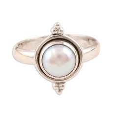 The luminous purity of a cultured white pearl takes center stage on this sterling silver ring from India's Rakesh Rana. The pearl is set on a simple band with a bead-accented bezel. Sterling Silver Pearl Ring With Pearl Drop, Classic Sterling Silver Pearl Drop Ring, Adjustable Pearl Ring For Formal Occasions, Adjustable Stackable Round Pearl Ring, Adjustable Formal Pearl Ring, Classic Pearl Ring With Bezel Setting, Classic White Pearl Ring With Bezel Setting, White Pearl Ring With Bezel Setting In Classic Style, Classic Adjustable Pearl White Pearl Ring