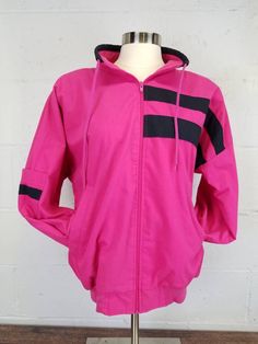 Vintage 1980s Westside Connections Hot Pink and Black Colorblock Windbreaker Jacket size small.  Zip front light weight poly cotton windbreaker.  Black and hot pink colorblock.  Two side pockets and one sleeve pocket.  Zip up collar with a drawstring.  Very Good vintage condition.  Shoulder pads.  No rips, holes or noticeable stains.  One or two very light spots that don't show in photos. Tagged size small. Please refer to measurements provided to determine proper as vintage sizes can vary great Westside Connection, Colorblock Windbreaker, Black And Hot Pink, Muumuu Dress, 80s Denim, Prairie Skirt, Boho Jeans, Light Spots, Eve Outfit