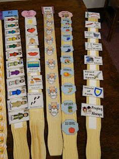 several wooden ties are lined up on a table with name tags and stickers attached to them