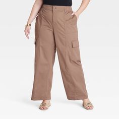 Add some on-trend style to your casualwear wardrobe with these High-Rise Cargo Pants from Ava & Viv™. Tailored in a straight regular-leg silhouette, these high-rise cargo pants are made from soft, stretchy woven fabric to keep you moving in absolute comfort. A fly button and zipper closure with an elastic waist provides you a secure fit, while side, back and cargo pockets give you space for on-the-go essentials. Pair them with a variety of tees, tanks or sweatshirts for versatile wear. Outfit Plan, Trend Style, Womens Clothing Sizes, Bottom Clothes, Pull On Pants, Chinos Pants, Bottoms Pants, Cargo Pants, Wide Leg Pants