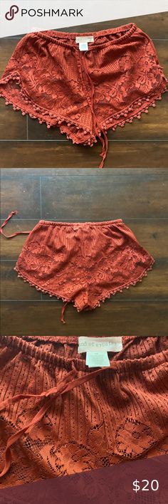 Band of Gypsies Rust Lace Shorts New never worn rust colored lace shorts. See through around the lace bottom. Cute bathing suit coverup or just roaming the streets. Band of Gypsies Shorts Bermudas Bohemian Style Fitted Short Bottoms, Red Shorts For Beach Season Loungewear, Red Shorts For Loungewear And Beach Season, Red Beachwear Bottoms For Loungewear, Red Beachwear Loungewear Bottoms, Red Bohemian Bottoms For Beach Season, Bohemian Stretch Short Bottoms, Bohemian Red Bottoms For Beach Season, Red Bohemian Shorts For Spring