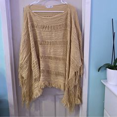 Super Cute Tan Mustard Yellowish Poncho Perfect For All Seasons And Boho Style!! Size Os Really Big And Roomy Fits Me As An Xl Would Definitely Fit 1x Maybe Even 2x Length Measurements Are 27inches Perfect For Warm Fall Days Winter Or Beach Cover Ups Bundle And Save!! Items May Come With Few Stray Cat Hairs I Try My Best To Clean Them Before Shipping Any More Questions Please Ask!! Price Firm!!!!!!!!!!!! Cozy Beige Beach Sweater, Beige Knitted Sweater For Vacation, Beige Knit Poncho, Beige Knit Poncho One Size, Beige Crochet Top For Fall Vacation, Cream Sweater For Beach In Fall, One-size Beige Knit Poncho, Casual Open Knit Poncho One Size, Casual Open Knit Poncho