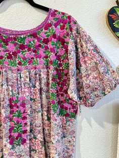 Our San Antonino dresses are unique, beautiful and perfect for any fiesta, a day at the beach or a formal event. You can easily dress it up or dress it down. Our dresses are completely hand embroidered by Artisans in Oaxaca, Mexico. It takes approximately 1 month to complete one dress.  Our San Antonino dresses are one of a kind. You will fall in love with every single detail. Each dress is hand embroidered on front chest area, sides and back with tiny floral designs inspired by the flowers in t Floral Patchwork Short Sleeve Dress For Garden Party, Floral Patchwork Short Sleeve Garden Party Dress, Short Sleeve Floral Patchwork Dress For Garden Party, Floral Print Short Sleeve Embroidered Dress For Garden Party, Short Sleeve Embroidered Floral Dress For Garden Party, Short Sleeve Floral Embroidered Dress For Garden Party, Multicolor Floral Patchwork Dress For Garden Party, Multicolor Floral Patchwork Short Sleeve Dress, Multicolor Short Sleeve Dresses With Floral Patchwork