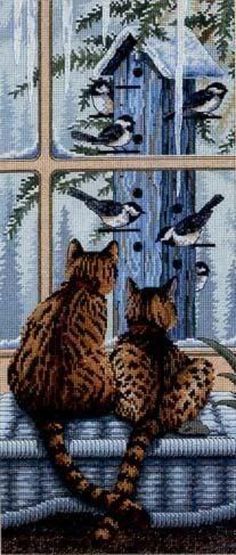 two cats sitting on a window sill with birds flying over them and one cat looking out the window