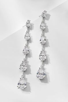 Introduce glamour to your look with these multi-CZ earrings. The graduated pear-shaped stones create a dazzling display that will draw the eye and sparkle with every movement. Wedding Earrings Bride, Diamond Earrings Wedding, Teardrop Diamond, Bride Earrings, Diamond Dangle Earrings, Cz Earrings, Fine Jewellery Earrings, Wedding Earrings, Ring Bracelet