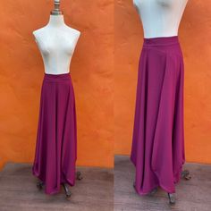 "Vintage maxi skirt Magenta purple zips in back Fantastic draped bustle effect EUC Waist: 30\" Hip: open (up to 54)\" Length: 39\" INSTAGRAM: @macabreatheart" High Waist Purple Lined Skirt, Purple Fitted Flared Skirt, Purple Relaxed Flared Skirt, Purple Pleated Flowy Maxi Skirt, Fitted Asymmetrical Purple Skirt, Purple Gathered Skirt Bottoms, Fitted Purple Asymmetrical Skirt, Purple Flowy Pleated Maxi Skirt, Purple Relaxed Pleated Maxi Skirt