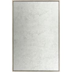 a white marble framed mirror on a wall