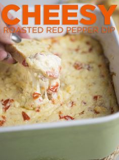 a person scooping cheese from a casserole in a green dish with text overlay that reads cheesy roasted red pepper dip